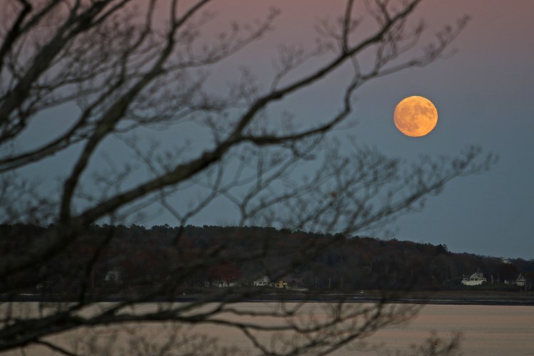 The moon rises over Casco Bay Sunday evening behind a barren tree at Fort Allen Park on Portland's Eastern Promenade. The supermoon is extra super, as it's the closest the moon has been to Earth since 1948, according to WCSH6 meteorologist Jessica Conley, who noted the moon won't be this close again until Nov, 25, 2034. It's technically full at 8:52 a.m. Monday This is actually our second supermoon of this year, with one more still to come on Dec. 14. November's full moon is also called the Beaver Moon or the White Moon, Conley said.