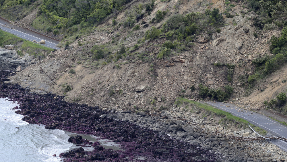 Railway tracks of the main trunk railway line are displaced by a massive landslide that also blocks State Highway One on the coastline north of Kaikoura, New Zealand, after a powerful earthquake Monday triggered landslides and a small tsunami.