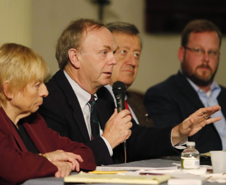Author and political strategist Alan Caron, center, joined by, left to right, Attorney General Janet Mills, former chairman of the Maine Democratic Party Severin Beliveau and Lance Dutson, speaks at Monday's forum at the First Parish Church.