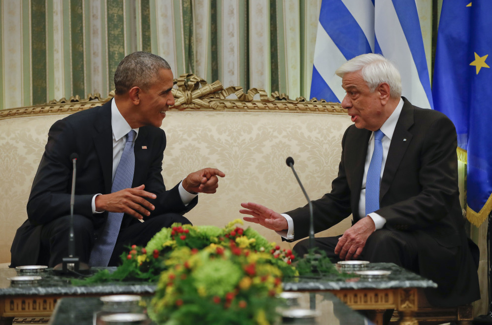 President Obama meets with his Greek counterpart Prokopis Pavlopoulos at the Presidential Mansion in Athens, Tuesday. Obama is scheduled to deliver a speech on Wednesday before heading to Berlin later the same day as part of his last major trip abroad.