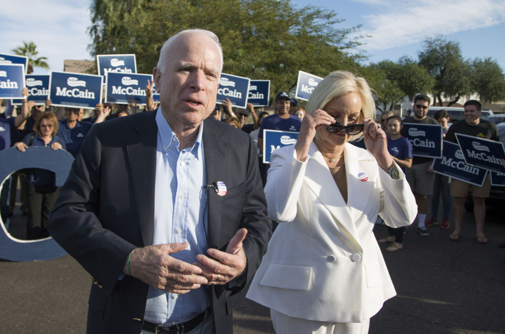 Sen. John McCain, shown with wife Cindy McCain in Phoenix on Election Day, says President-elect Donald Trump's attempted 'reset' with Russia is out of line.
