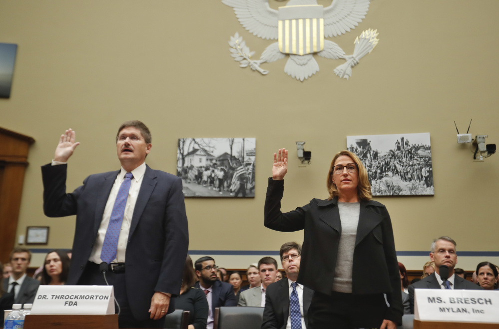 Mylan CEO Heather Bresch and Dr. Doug Throckmorton, deputy director, Center for Drug Evaluation and Research at the FDA, are sworn in on Capitol Hill before testifying before the House Oversight Committee.