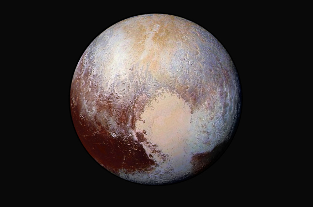 A July 24, 2015, combination of images of Pluto, captured by the New Horizons spacecraft. Wednesday scientists said an ice-filled impact basin may have acted as extra weight causing the planet to wobble away from its original axis spin.