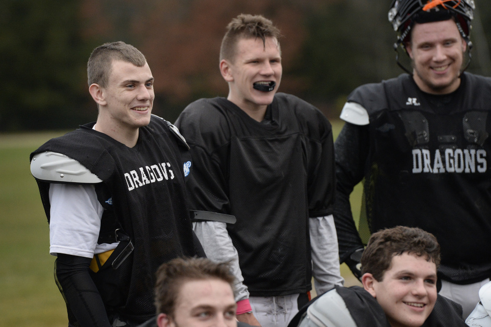 Devereaux, left, shares a laugh with teammates during practice Wednesday. Shawn Patrick Ouellette/Staff Photographer