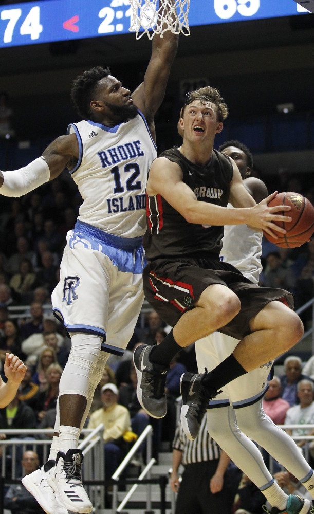 Brown's Steven Spieth looks for a shot as Rhode Island's Hassan Martin defends during Rhode Island's 79-72 win in Kingston, R.I.