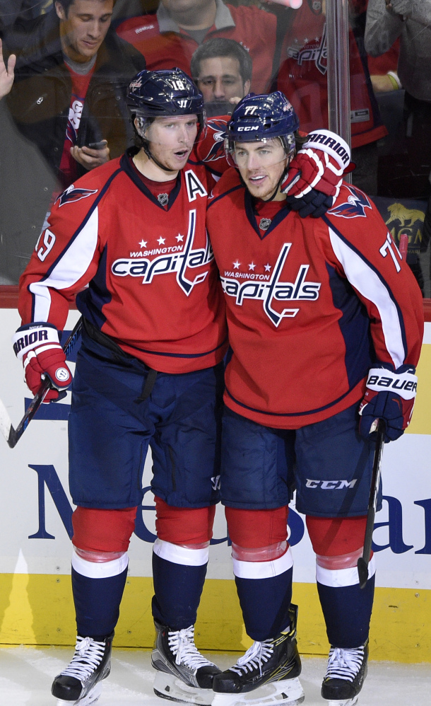 Nicklas Backstrom, left, and T.J. Oshie of the Capitals celebrate after Backstrom's second goal of the game in a 7-1 victory over Pittsburgh.