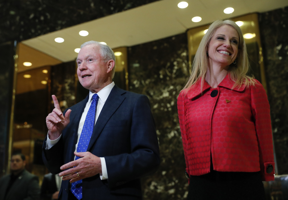 Sen. Jeff Sessions, R-Ala., and Kellyanne Conway, campaign manager for President-elect Donald Trump, speak to reporters at Trump Tower in New York on Thursday.
