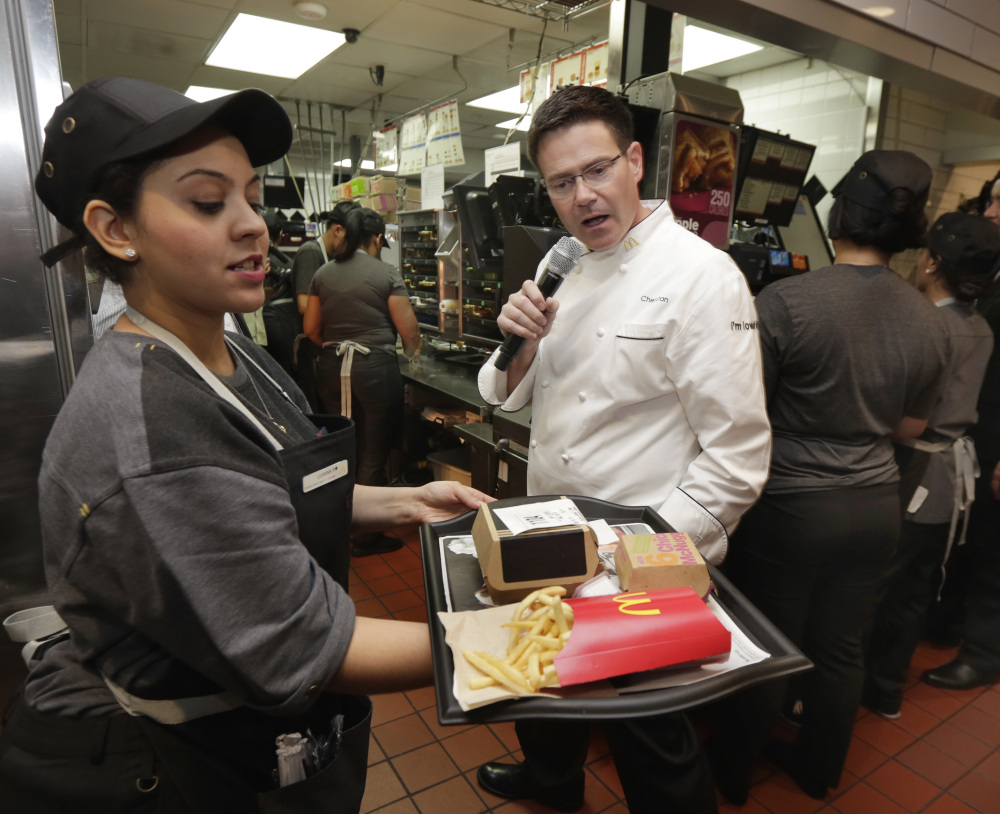 Table service is already available at McDonald's in some areas, including New York City, where company Executive Chef Dan Coudreaut checked an outgoing order Thursday. The restaurant chain plans to roll out the service nationwide.