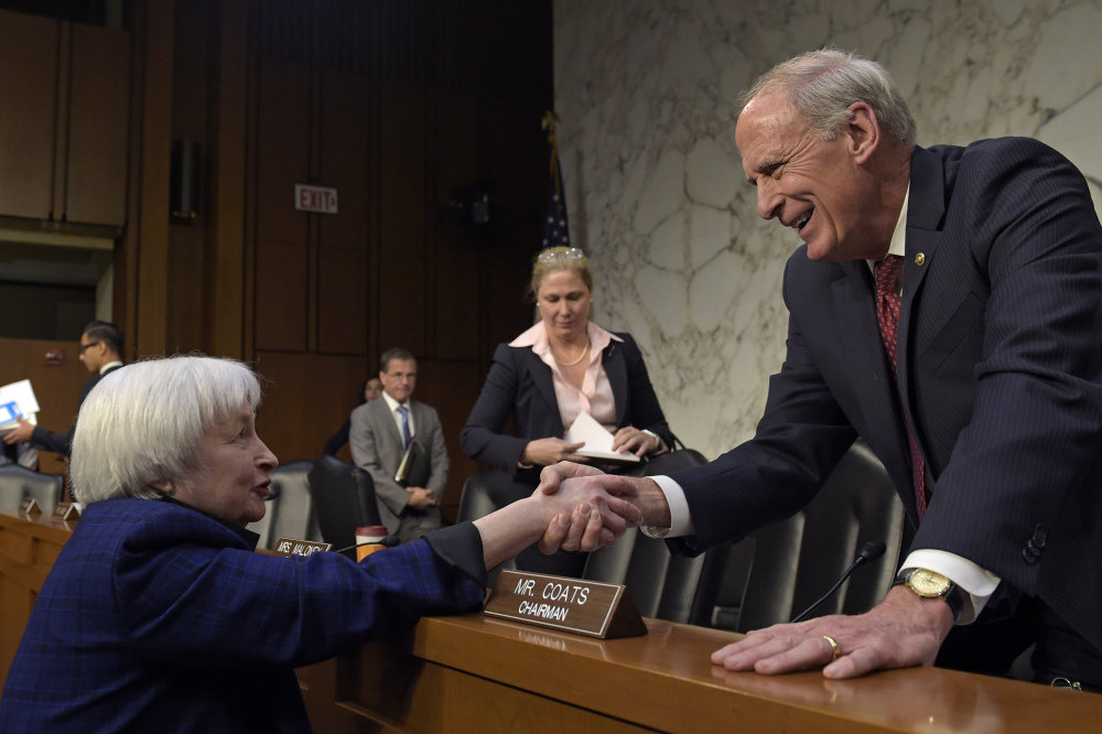 Federal Reserve Chair Janet Yellen, left, shakes hands with Joint Economic Committee Chairman Sen. Dan Coats, R-Ind. after she testified on Capitol Hill in Washington on Thursday.