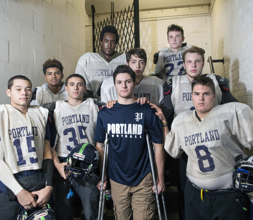 The Portland High seniors have rallied around Nick Archambault, who suffered a season-ending knee injury in the third game of the season. Archambault now helps break down film and counsels teammates during games.