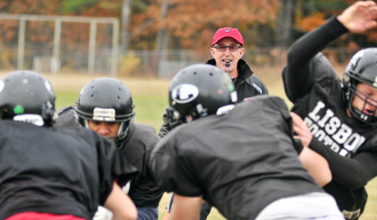 Lisbon head football coach Dick Mynahan watches the team practice Tuesday in Lisbon. He's stepping down after 30 years.