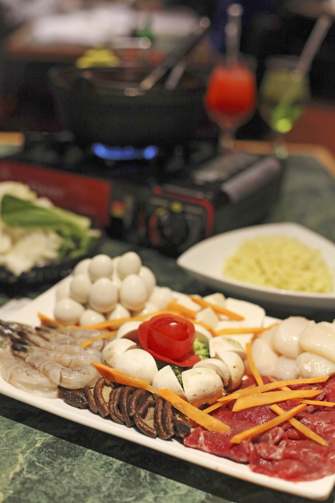 This hot pot features house special broth, fish cakes, raw steak, rice noodles, shiitake mushrooms, bok choi and fresh tofu.