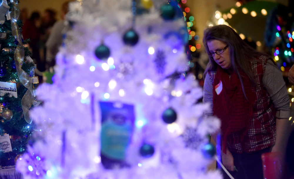 Tammy Richards of Fairfield browses among the trees on Friday.