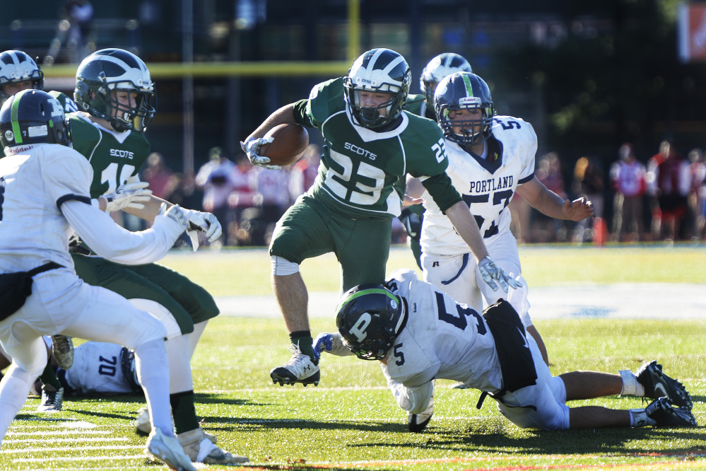 Bonny Eagle running back Alex Sprague eludes defenders during the Scots' 34-14 win over Portland in the Class A state championship game Saturday at Fitzpatrick Stadium.