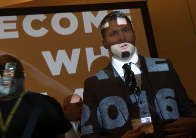 Richard Spencer, president of the National Policy Institute, answers questions Saturday from the media at the annual white nationalist conference hosted by his organization.