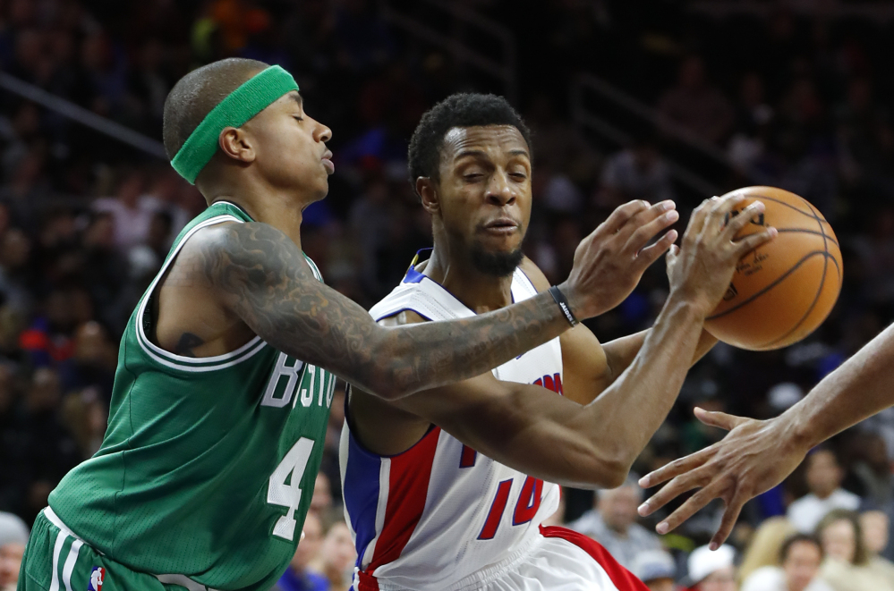 Detroit Pistons guard Ish Smith drives on Celtics guard Isaiah Thomas in the second half of Saturday's game in Auburn Hills, Mich. Al Horford's basket with 1.3 seconds left lifted Boston to a 94-92 win. (Associated Press/Paul Sancya)
