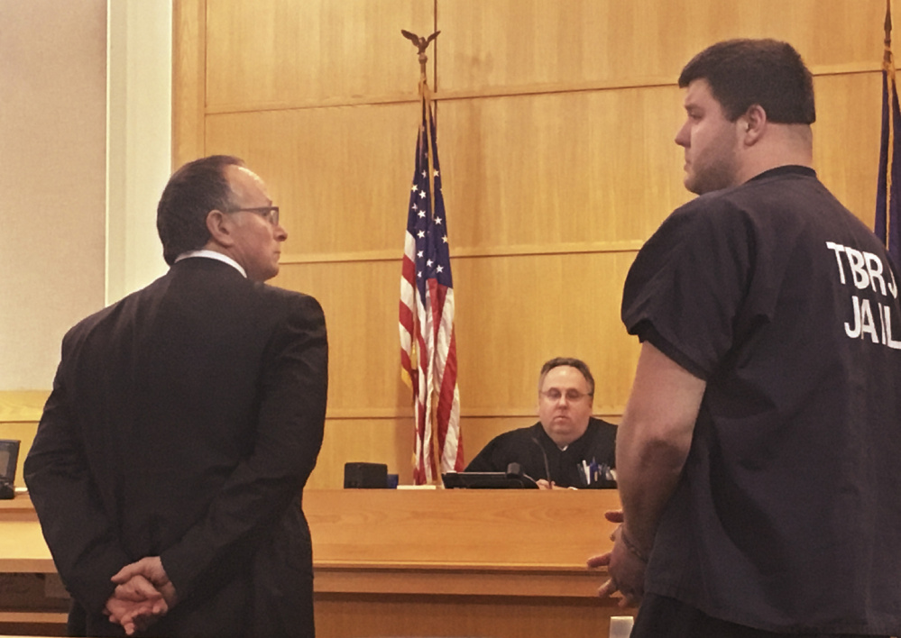 Dylan Grubbs addresses the family of Chelsea Jones on Monday in Sagadahoc County Superior Court in West Bath. Grubbs was sentenced to 2½ years in jail for the accidental shooting death of Jones in February. At left is David Paris, Grubb's attorney.