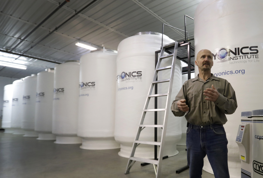 Andy Zawacki, the manager at the Cryonics Institute, stands next to storage containers at the facility on Monday in Michigan.