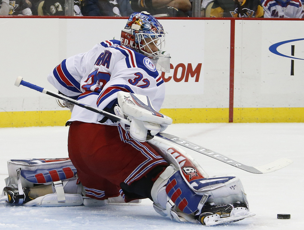 New York Rangers goalie Antti Raanta makes one of his 29 saves in a 5-2 win over the Penguins at Pittsburgh on Monday.