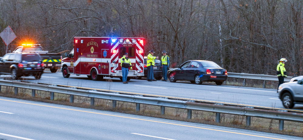 Maine State Police troopers and Augusta Fire Department crews respond to a crash Tuesday in the southbound lanes of Interstate 95 in Hallowell between the Maple Street overpass and the Central Street underpass.
