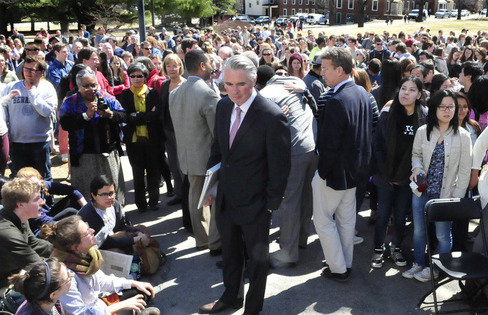 Colby College President David Greene, center, makes his way through more than 500 students and staff members on April 16, 2015, at the Waterville campus to speak during a forum on racial issues.