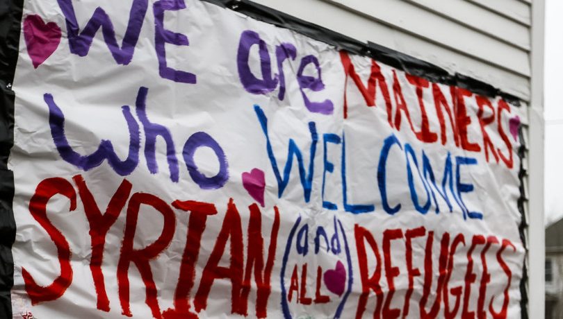 A sign put up on a home in Portland's Munjoy Hill neighborhood a year ago remains relevant.
