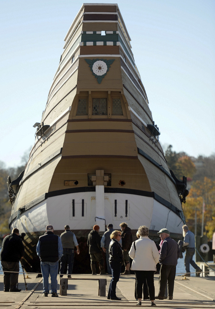 Spectators watch as the Mayflower II is placed on the ship-lift to be hauled out of the Mystic River at the Henry B. duPont Preservation Shipyard in Stonington, Conn.
