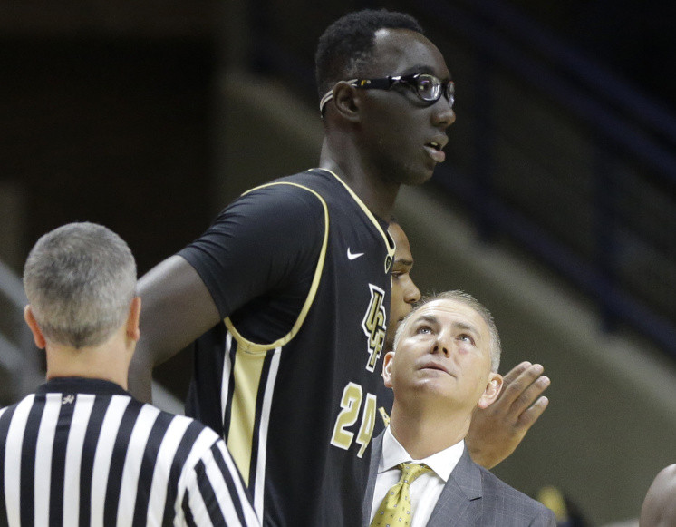 Tacko Fall, with former coach Donnie Jones as a freshman last season at Central Florida, has turned heads as a 7-foot-6 center, with so much potential still to be unleashed.