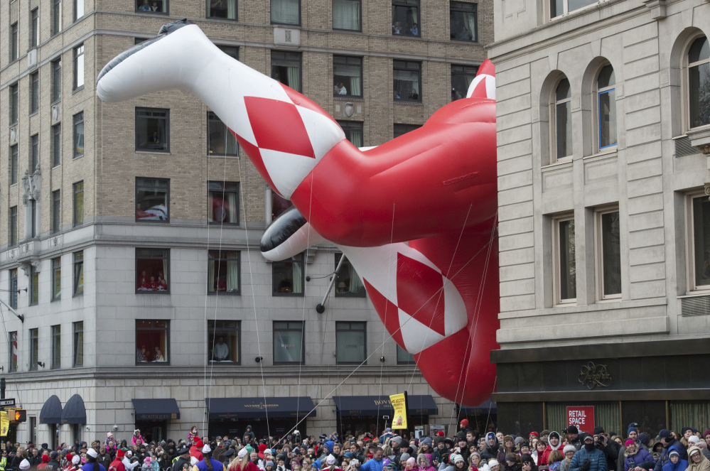 A Mighty Morphin Power Ranger balloon turns onto Sixth Avenue during the Macy's Thanksgiving Day Parade on Thursday in New York.