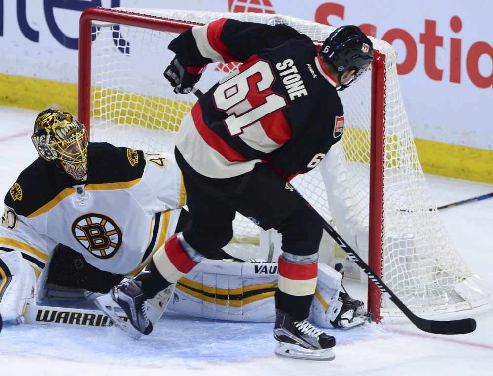 Ottawa's Mark Stone beats Boston goalie Tuuka Rask for second-period goal, tying the game 1-1, in Ottawa on Thursday night. The Senators scored twice in the third period for a 3-1 win. (The Canadian Press/Sean Kilpatrick)