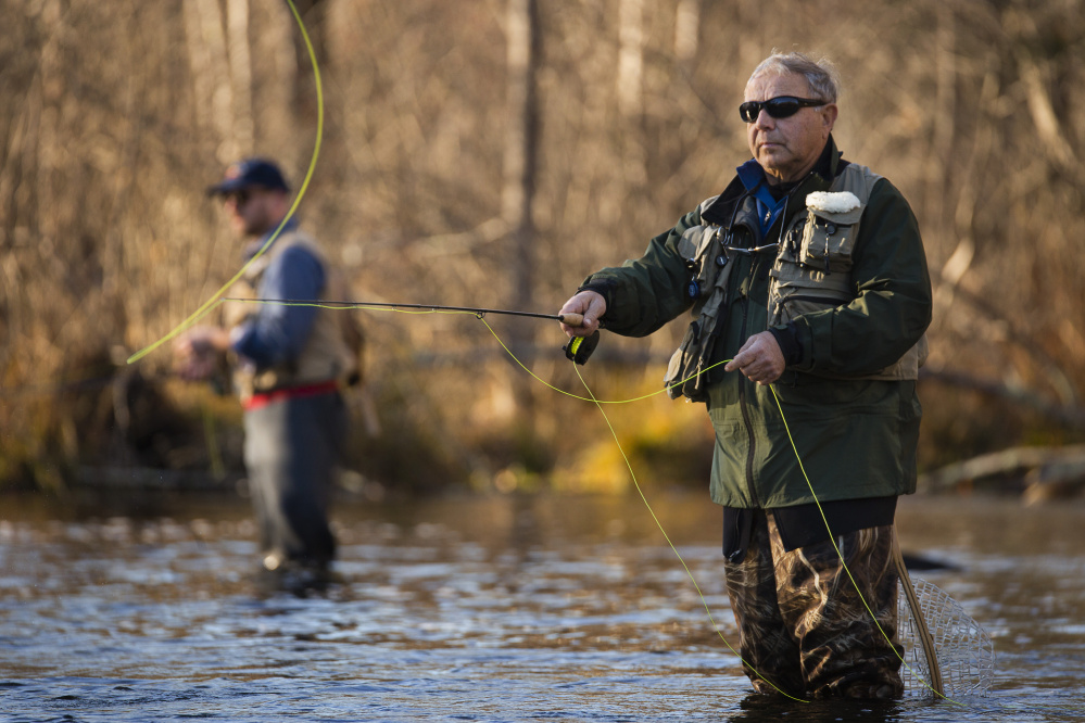 Loyd Martin of Raymond fly fishes for trout and salmon on the Presumpscot River in Windham on Nov. 17. Sappi North America has agreed to remove a dam and install a fish passage where the river runs through downtown Westbrook.