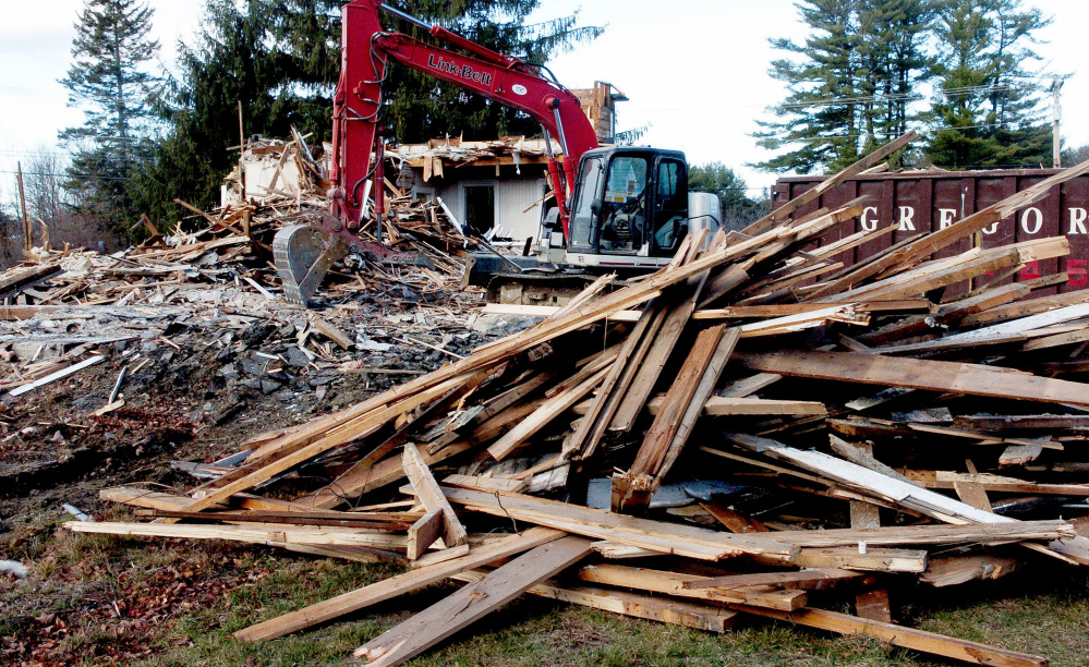 A farmhouse owned by the Trinity Evangelical Free Church in Skowhegan is demolished with plans to build a new 48-bed family shelter from the ground up.