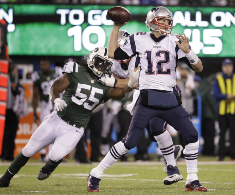 Patriots quarterback Tom Brady earned his 200th win and surpassed 60,000 yards passing Sunday, but looked lost trying to block for LeGarrette Blount.