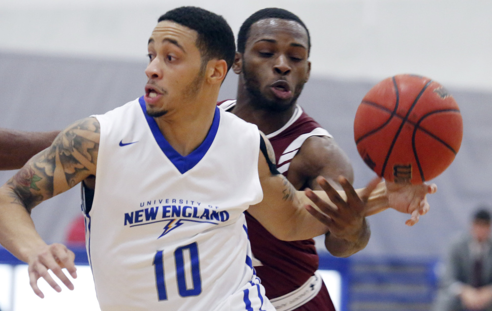 Eli Frater of Bates strips the ball from Jean-Luc Parker of UNE. The Bobcats rallied from eight down early in the second half to beat the Nor'easters.