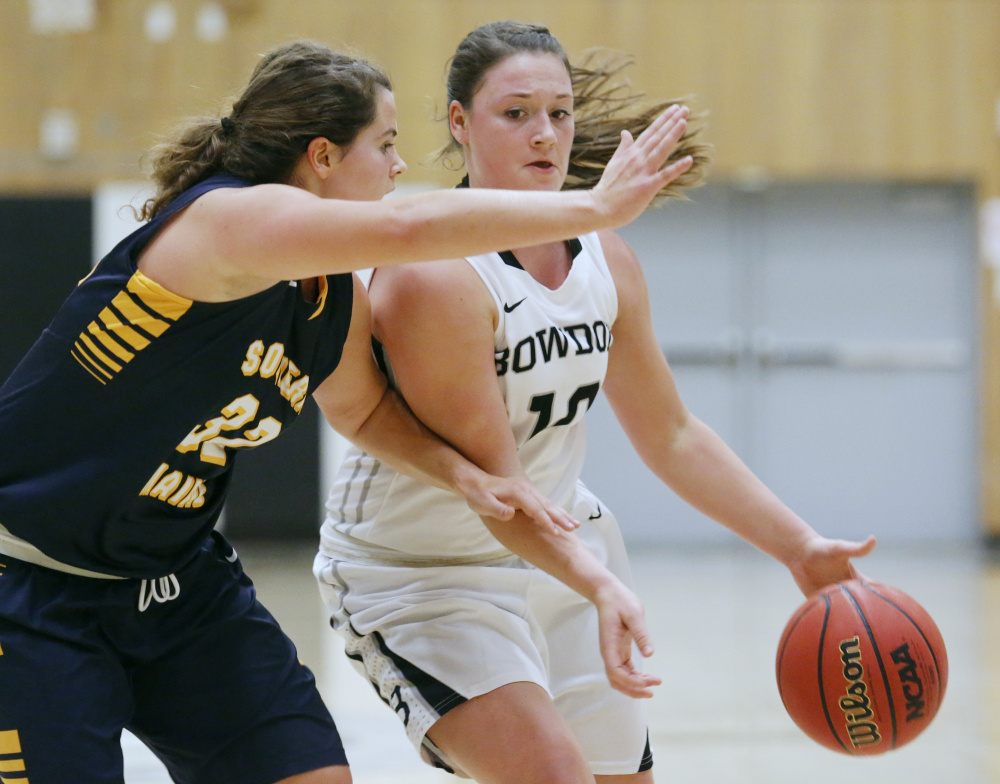 Bowdoin's Lauren Petit tries to drive past Southern Maine's Mychaela Harton during the Polar Bears' 85-40 win Tuesday in Brunswick.