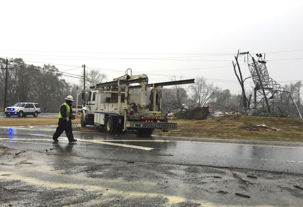 Responders prepare to leave the site of a damaged transformer in Benton Tenn., on Wednesday. Thunderstorms dumped much-needed rain on eastern Tennessee overnight as thousands of people waited anxiously for news about their homes after wildfires tore through the area.
