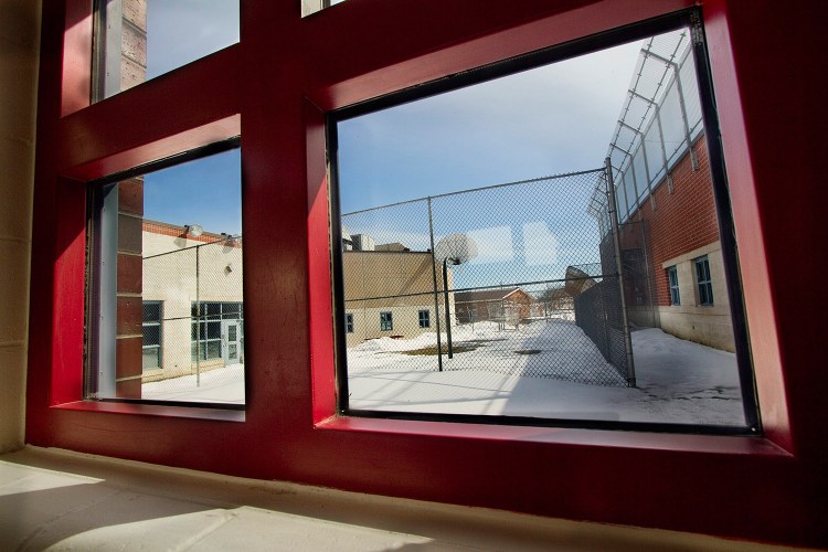 A hallway window at the Long Creek Youth Development Center looks out on a fenced-in activity yard at the South Portland facility. Questions are being raised after a suicide there in October.  