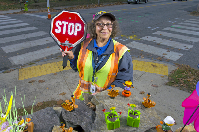 Michele Danois, crossing guard, at her daily location at the corner of Thompson and Pillsbury streets.