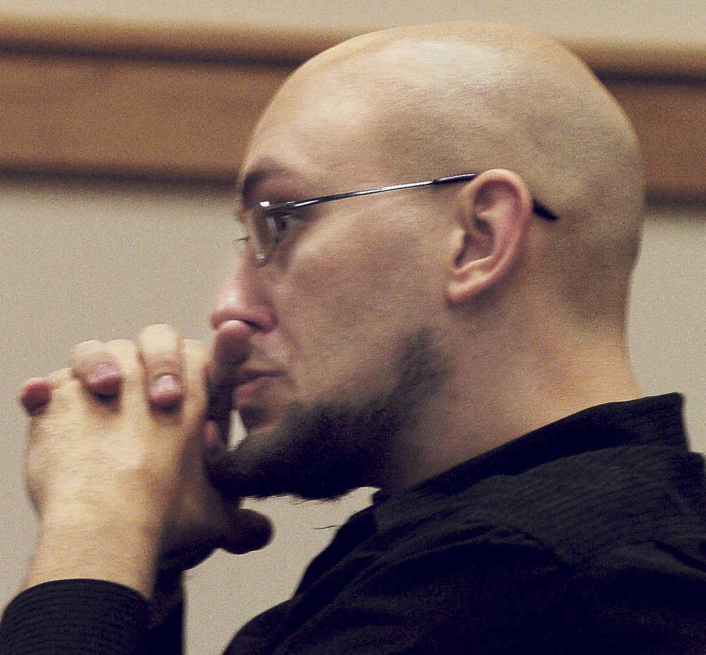 Zachary Casey listens to court proceedings during his arraignment Wednesday on class A arson in Skowhegan District Court.