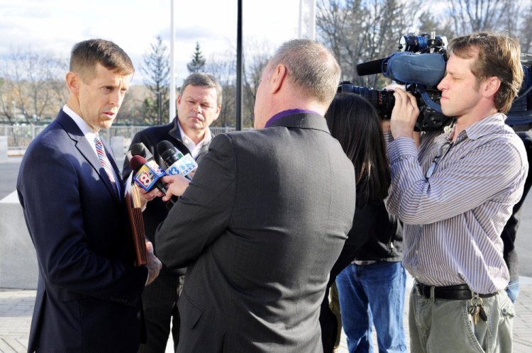 Attorney Walter McKee, who represents Andrew Balcer, 17, of Winthrop, accused of killing his parents, speaks to reporters outside the Capital Judicial Center Thursday following a hearing.