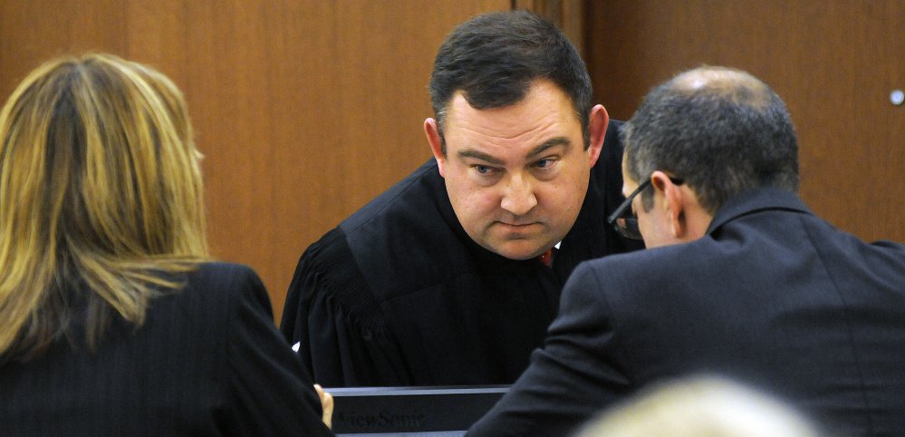 Judge Eric Walker confers Tuesday with Kennebec County Assistant District Attorney Tracy Devoll and defense attorney Charles T. Ferris during the trial of Danielle Jones. 