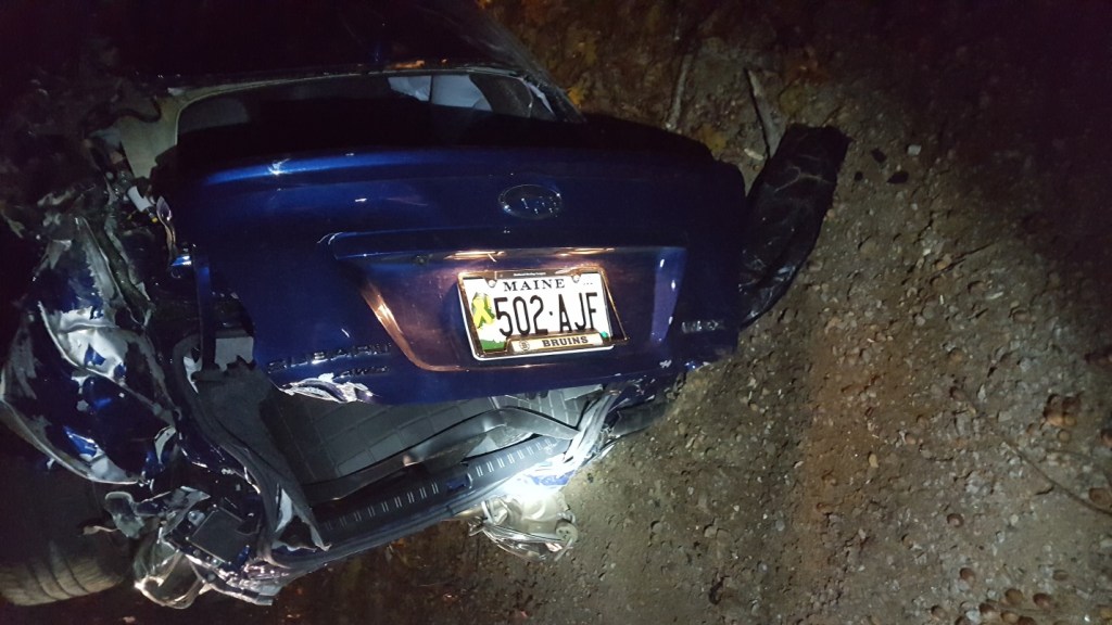 This car overturned on Mouse Lane in Alfred late Saturday night. A 31-year-old Alfred man died in the crash. Photo courtesy Maine State Police