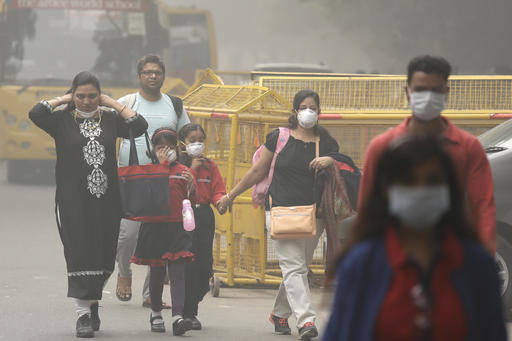 An Indian family arrives at a protest against air pollution in New Delhi on Sunday. 
Associated Press/Manish Swarup