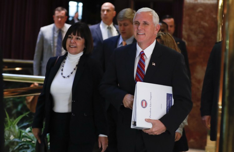 Vice President-elect Mike Pence arrives at Trump Tower on Tuesday with his wife, Karen. Pence and Donald Trump met for close to six hours as they considered key appointments for the new administration.