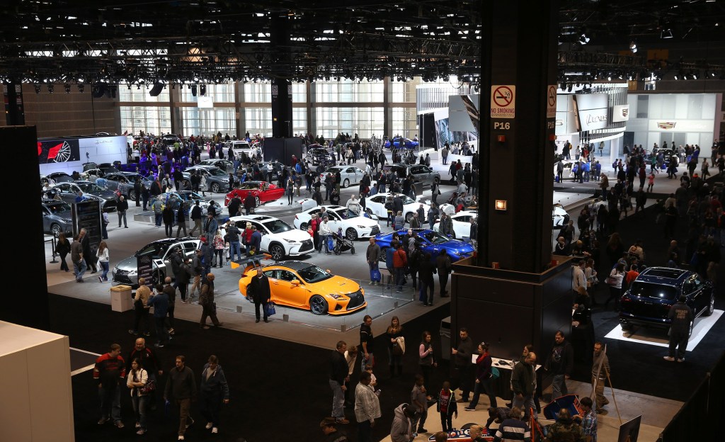Thousands of people flock to see new cars debuting at the Chicago Auto Show in February of this year.
