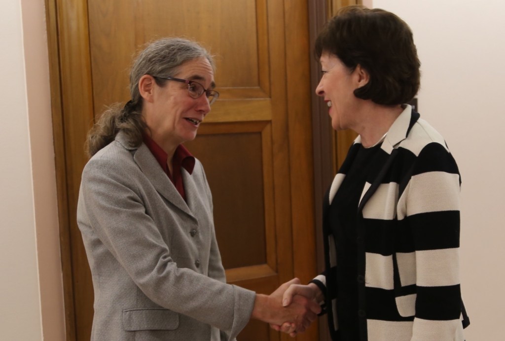 Sen. Susan Collins greets Jaye Martin, director of Maine Legal Services for the Elderly, on Wednesday in Washington. 