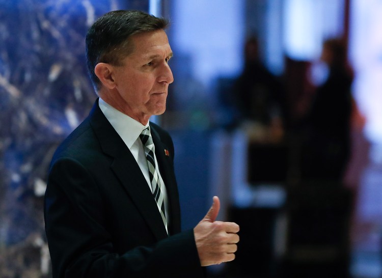 Retired Lt. Gen Michael Flynn gives the thumbs-up as he arrives at Trump Tower on Thursday in New York. One source says he has been offered the job of national security adviser.