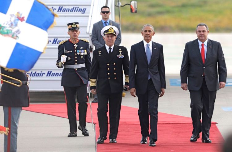 President Barack Obama walks next to Greek National Defense Minister Panos Kammenos, right, after his arrival at the Athens International Airport Eleftherios Venizelos on Tuesday. 
<em>Associated Press/Thanassis Stavrakis</em>