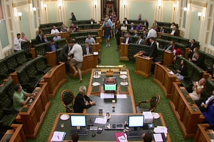 Lawmakers arrivie in the middle of the night at the Australian state Parliament in Brisbane.