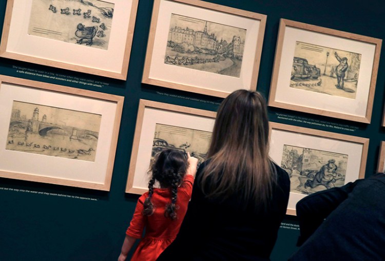 Children enjoy the drawings of Robert McCloskey at the "Make Way for Ducklings" exhibit at the Museum of Fine Arts in Boston. 